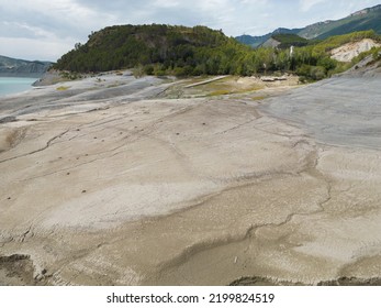 Swamp Mud With Low Water Level Close To Mountains