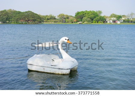 swan pedal boat floating on the lake