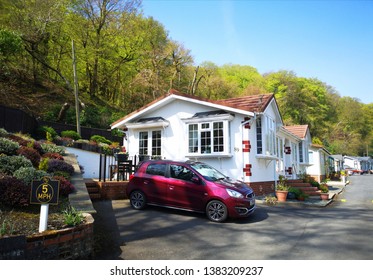 Swansea, UK: April 27, 2019: Residential mobile homes for retired persons only with gardens and car parking spaces.