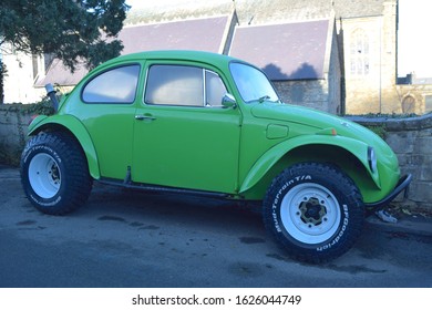 Swansea UK, January 21, 2020: Green Wolksvagen Car With Long Exhaust Pipe Is Parked In The Town.