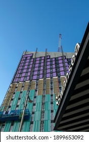 Swansea, UK - January 21, 2021: Construction Of Mariner Street Scheme Opposite Swansea Station (sign In The Foreground). The New Building Is A £50m Student Housing Accommodation Project.