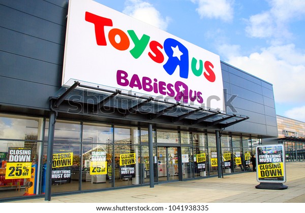 Swansea, UK:\
March 08, 2018: Front view of a Toys R Us store with closing down\
signs in the window. Toys R Us Inc. is an American toy retailer\
headquartered in New Jersey, USA.\
