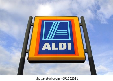 Swansea, UK: May 2016: Commercial sign of ALDI Store against a blue sky. ALDI is a large discount supermarket chain with app. 4200 stores in Germany. It specializes in lower priced products. 