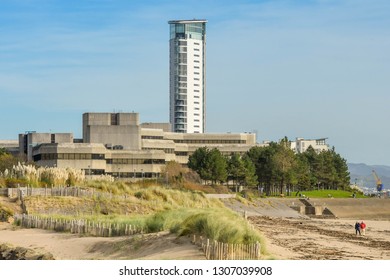 SWANSEA, WALES - OCTOBER 2018: The Seafront In Swansea With County Hall On The Left And The Tower At Meridian Quay Dominating The Skyline.