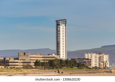 SWANSEA, WALES - OCTOBER 2018: The Seafront In Swansea With County Hall On The Left And The Tower At Meridian Quay Dominating The Skyline.