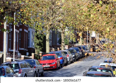 Swansea, Wales, UK - November 6, 2020, Tree Lined City Street Full Of Parked Cars