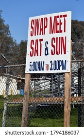 A Swap Meet Sign Telling The Hours