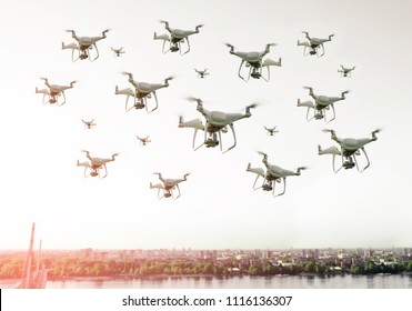 Swarm Of Drones Flying Over The City 