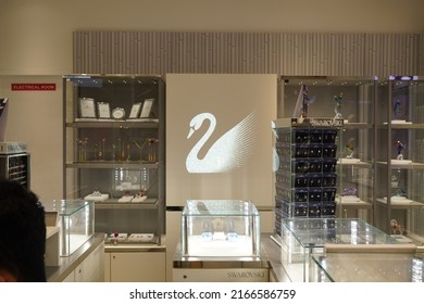 The Swarovski swan symbol and logo on a store front. Swarovski swan sign. Swarovski jewelry brand logo close up. Swarovski jewelry shop. - Dubai UAE - February 2022