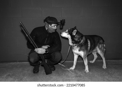 Swat K9, A Man With A Shotgun And A Night Vision Device With A Husky Dog.