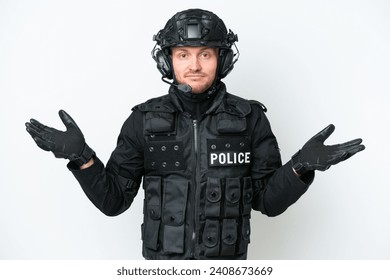 SWAT man over isolated white background having doubts while raising hands