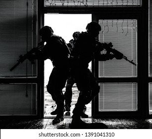 SWAT Team Breaching Door And Storming Apartments