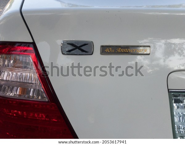 SWAT VALLEY,\
PAKISTAN - OCTOBER 05, 2021: Toyota x corolla 40th anniversary logo\
on a white 2006 model\
trunk