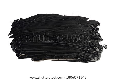 swatch of black smudged acrylic paint isolated on white background, close up