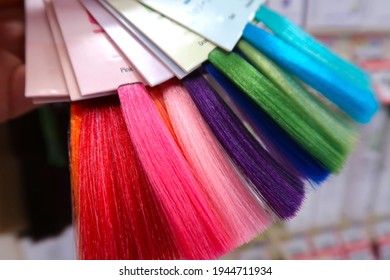 Swatches Of Bright Hair Dye Colors At The Store. Samples Of Results For Diy At Home Hair Dyeing Kits. Vibrant Unnatural Choices.