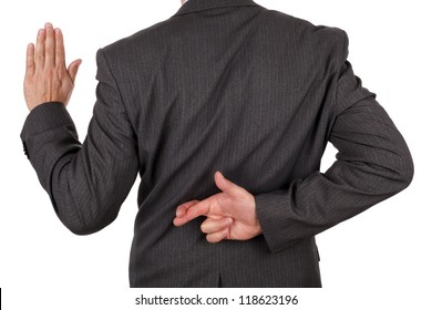 Swearing an oath with fingers crossed behind back concept for dishonesty or business fraud - Shutterstock ID 118623196