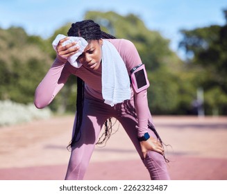 Sweat, exercise and black woman outdoor, tired and running for wellness, balance or cardio. African American female athlete, runner and lady with towel, rest or break after workout, training or relax - Powered by Shutterstock