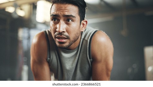 Sweat, fitness and man tired from gym, workout or rest in training in cardio, sports and body builder breathing with fatigue. Exhausted, break and athlete with commitment for health challenge - Powered by Shutterstock