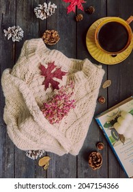 Sweater and coffee on flatlay view. 