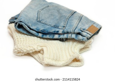 Sweater And Jeans On A White Background. Circular Fashion,swap Clothes Idea