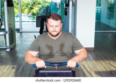 Sweating Chubby Man Walking On Running Track, Warming Up On Gym Treadmill