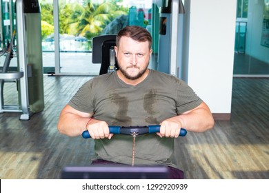 Sweating Chubby Man Walking On Running Track, Warming Up On Gym Treadmill