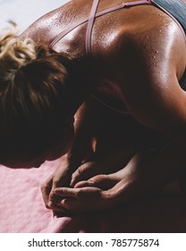 Sweating People Practicing Yoga During Retreat In Studio