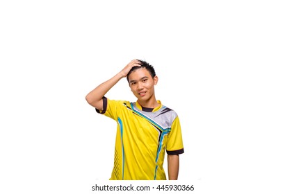 A sweaty boy in yellow casual sport uniform isolated