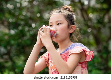 Sweaty Girl Drinking Canned Juice