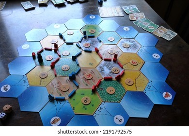 Jämtland, Sweden. 07-21-2022. The Board Game Settlers Of Catan. Famous Strategic Game For The Whole Family.