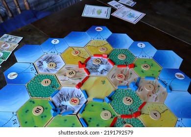 Jämtland, Sweden. 07-21-2022. The Board Game Settlers Of Catan. Famous Strategic Game For The Whole Family.