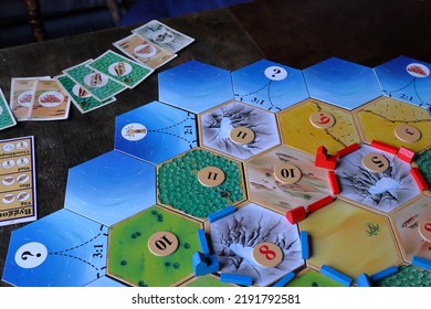 Jämtland, Sweden. 07-21-2022. The Board Game Settlers Of Catan. Famous Strategic Game For The Whole Family.