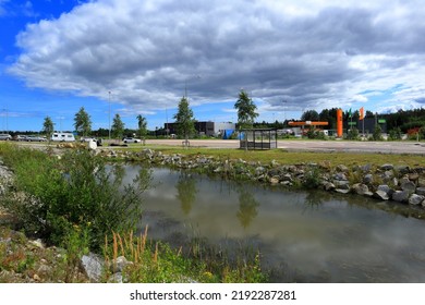 Jämtland, Sweden. 07-22-2022. Small Pond Next To A Road At A Urban Area. Summer Day.