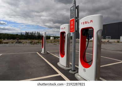 Jämtland, Sweden. 07-22-2022. Tesla Car Charging Station. Outside At A Parking Lot One Cloudy Summer Day.