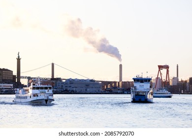 Göteborg, Sweden - Dec 02, 2021: Heavy boat shuttle traffic on the Göta River in Gothenburg. Public transportation in Gothenburg on water.