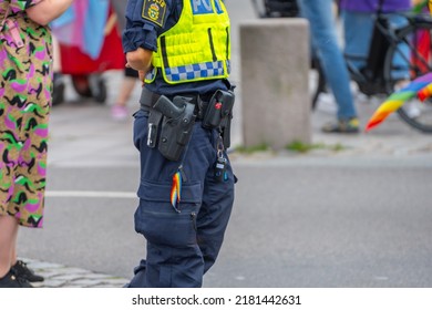 Malmö, Sweden - July 09 2022: Swedish Police Equipped With A Service Weapon, Mace, Baton And A Rainbow Coloured Key Chain.