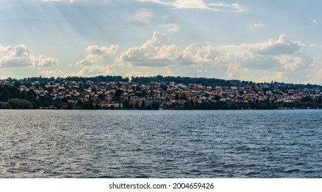 JÖNKÖPING, SWEDEN - JULY 3, 2021: Cityscape Over Jönkoping From Lake Vättern On A Beautiful Summer Day.