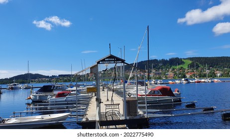 Östersund, Sweden - June 28, 2021: Boats In The Harbor Of Östersund, Island Of Frösön In The Background