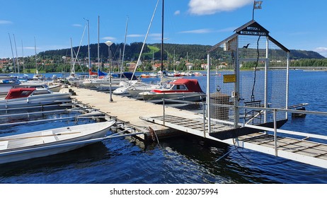 Östersund, Sweden - June 28, 2021: Boats In The Harbor Of Östersund, Island Of Frösön In The Background