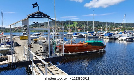 Östersund, Sweden - June 28, 2021: Boats In The Harbor Of Östersund, Island Of Frösön In The Background