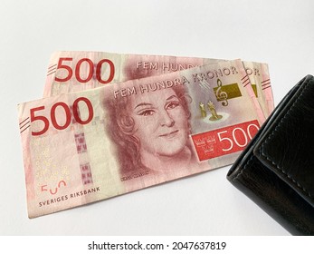 Sweden krone bills with black leather wallet isolated on white background. Swedish krona money - 500 fem hundra kronor. 