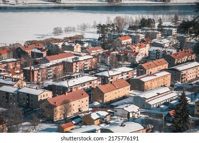 Östersund (Sweden Lapland) In March. Aerial View Of Cityscape Panorama With Snow And Frozen Lake Storsjön.