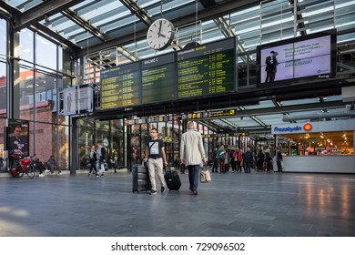 Malmö, Sweden - Sep  30, 2017: People Walking Under Departure And Arrival Board At The Malmö Central Station.