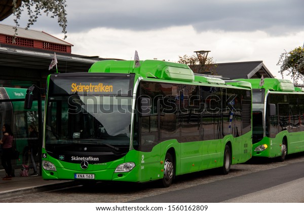 Malmö, Sweden -\
September 2, 2018: Two green Mercedes buses are waiting for\
passengers at Malmö Central Station. The environment friendly buses\
are operated by\
Skånetrafiken.