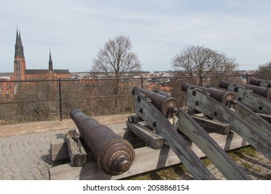 Sweden, Uppsala - April 19 2019: the view of the western bastion cannons of Uppsala Castle with The Uppsala Cathedral on background on April 19 2019 in Uppsala, Sweden.