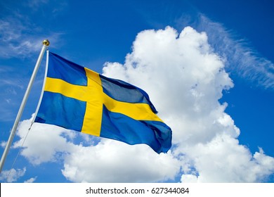 Swedish Flag On Blue Summer Sky