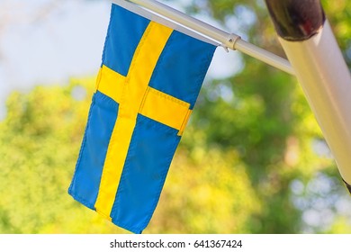 Swedish flag on a house - Powered by Shutterstock