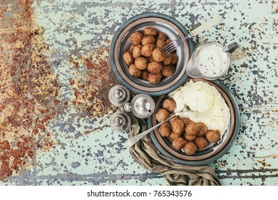 Swedish meatballs Kottbullar served with mashed potatoes, cream sauce and decorated with thyme. Top View. Copy Space