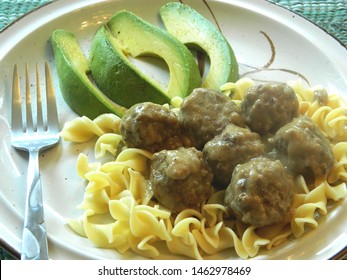 
		swedish meatballs over pasta and a side of avocado			