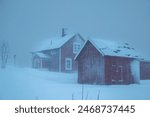 Swedish red houses in one of the strongest snowstorms of 2024, Hemavan, Sweden